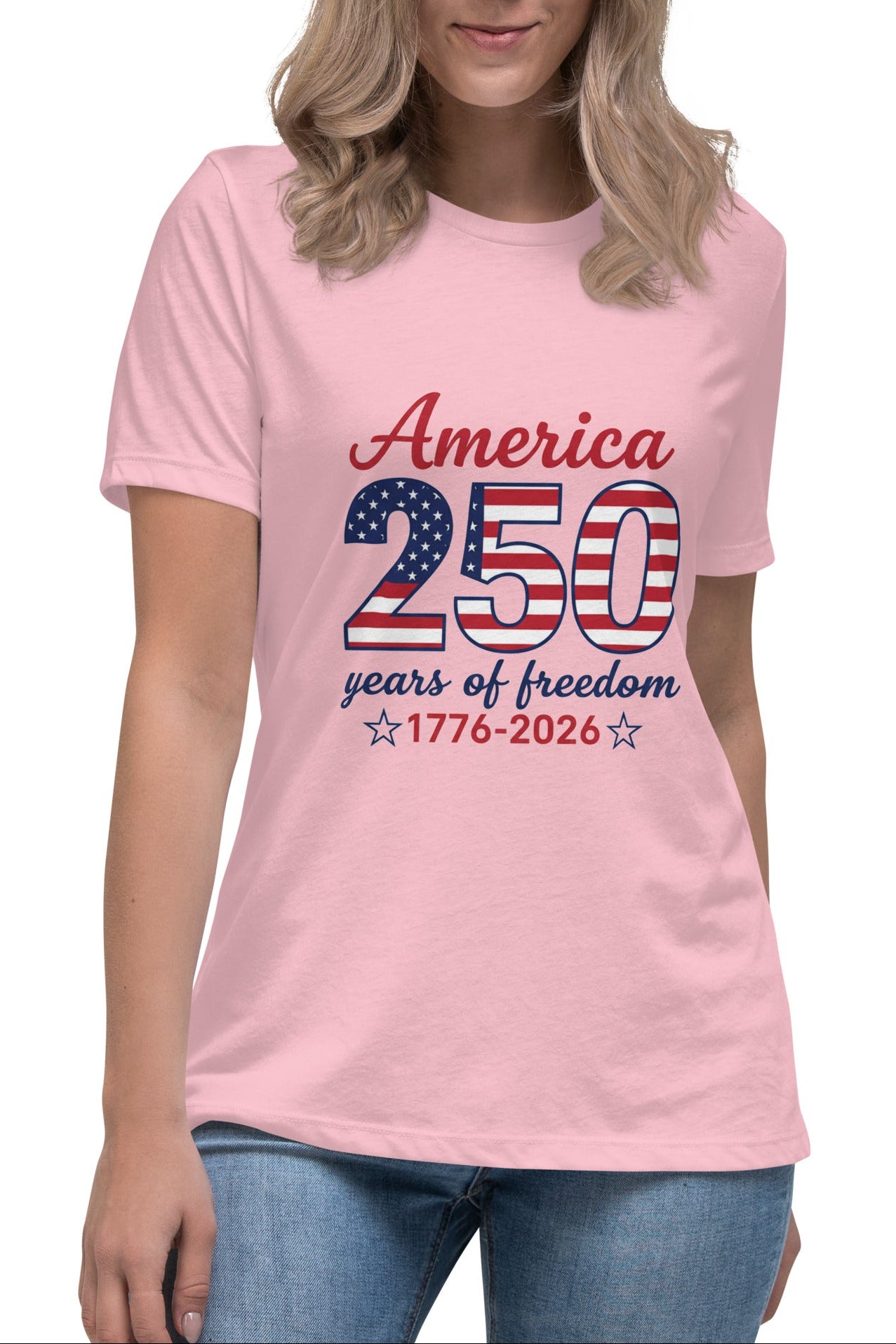 Person wearing a pink t-shirt with 'America 250 years of freedom' design on a white background